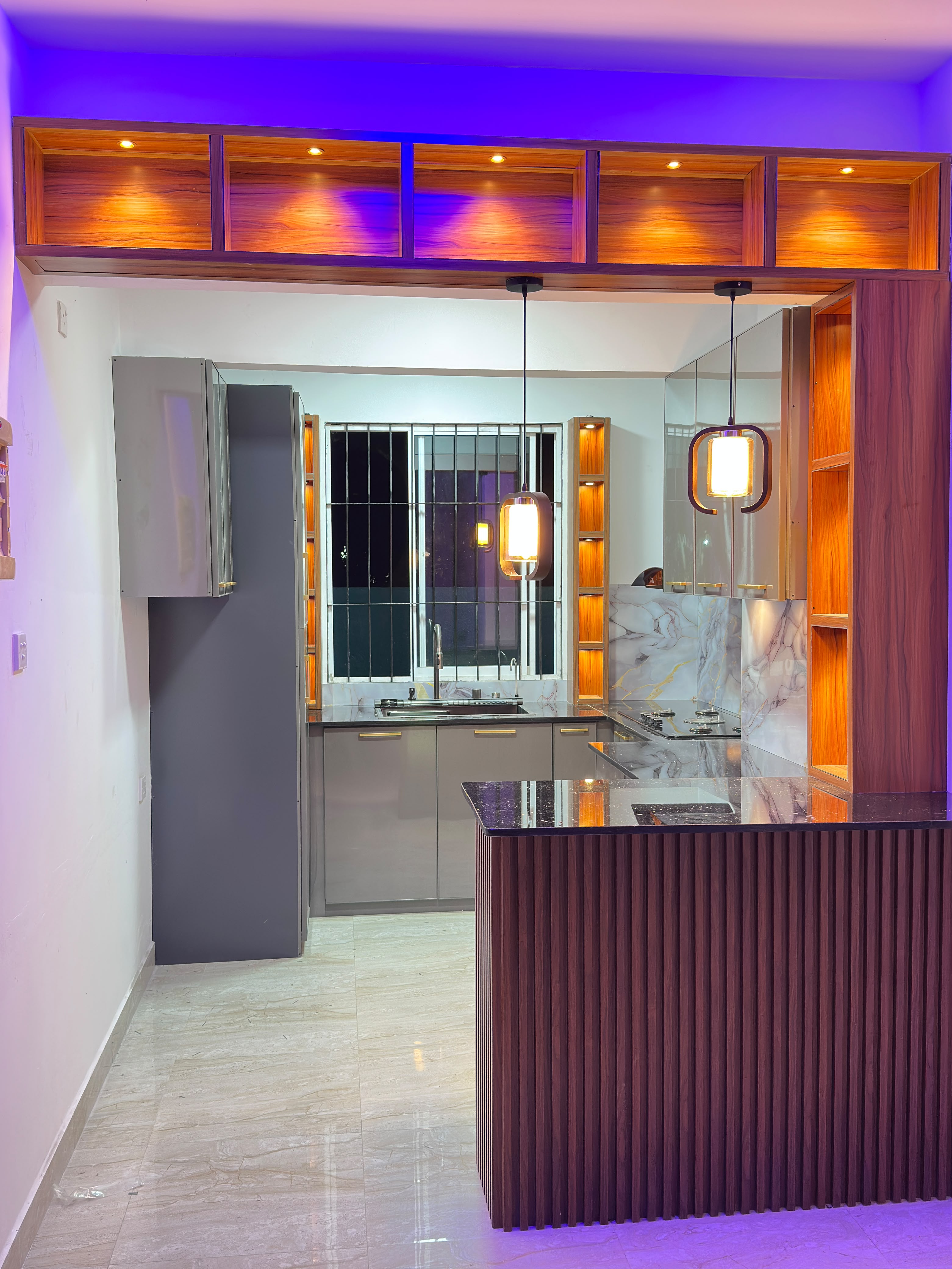 Kitchen with ambient lighting and wooden accents